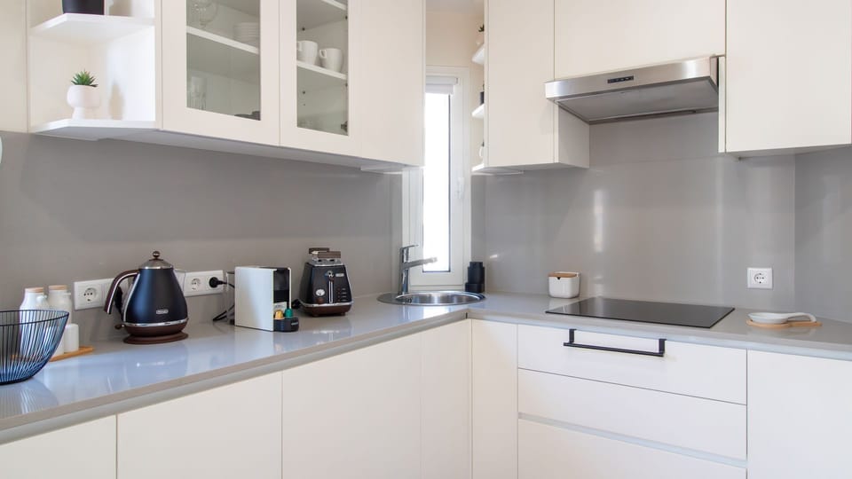 Kitchenette with high-end appliances and a perfect setup for cooking meals. #KitchenGoals #CookingInStyle