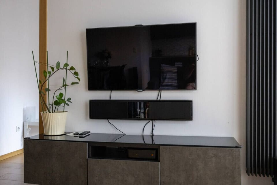 Living Room with Sofa, Smart TV and Dining Table | Book Now with RENTUJEMY.COM