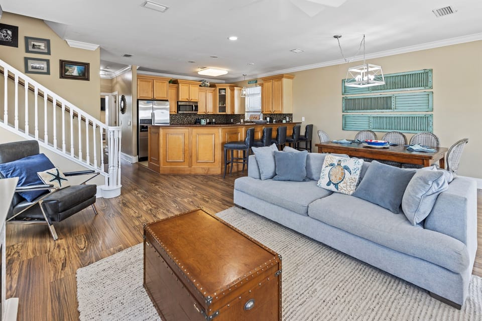 Settle into your spacious open-concept retreat where coastal charm meets modern comfort, perfect for gathering with loved ones.