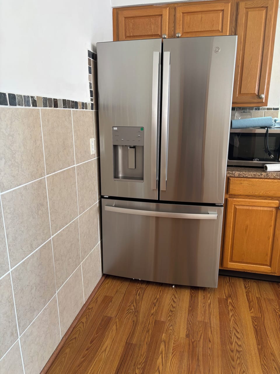 Brand new refrigerator with water and ice