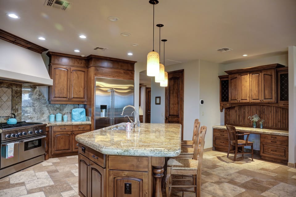 Walk-in pantry is behind the door above. Ice and water are dispensed from fridge