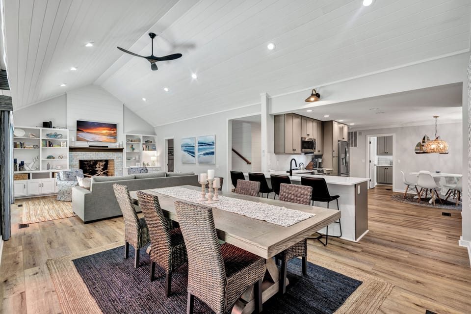 The open concept dining area flows effortlessly into the kitchen, making it ideal for entertaining and socializing