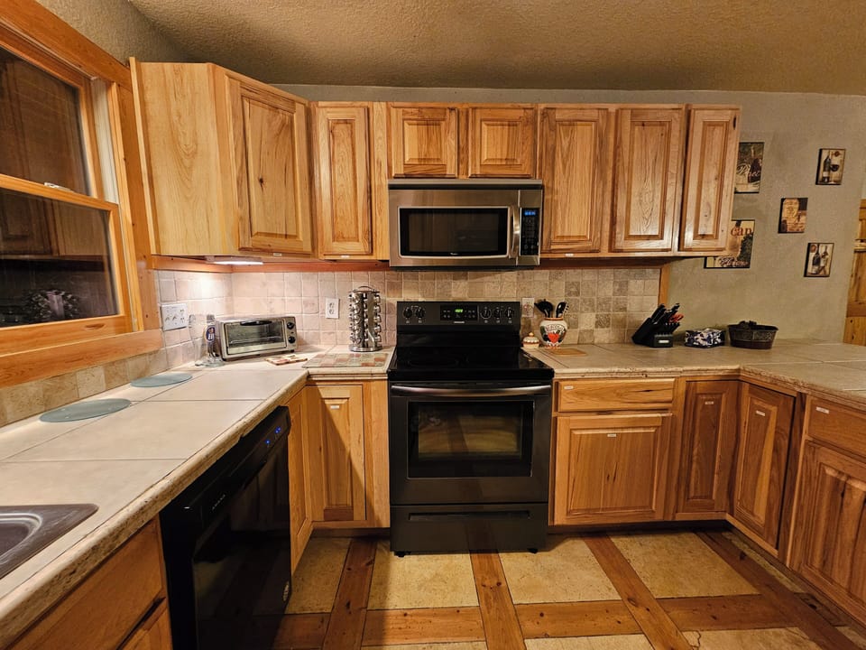 This kitchen is well equipped with all the necessities you could need.