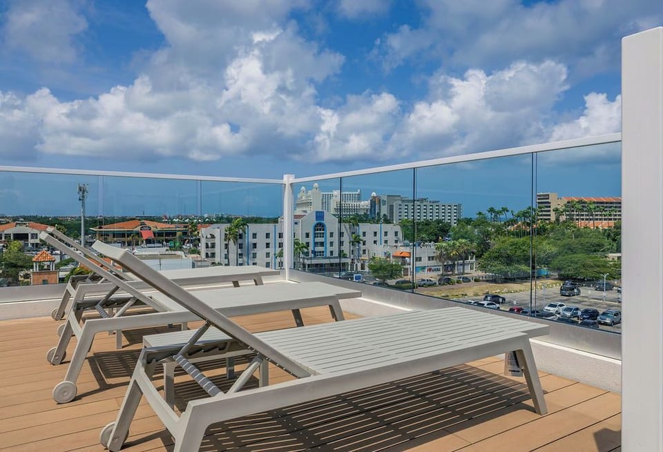 Lounging on the rooftop sunbed, soaking up the sun and the views.