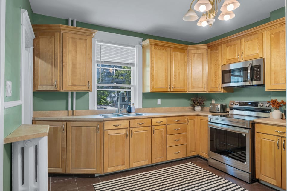 Clean and modern kitchen with a simple, practical layout for your stay.