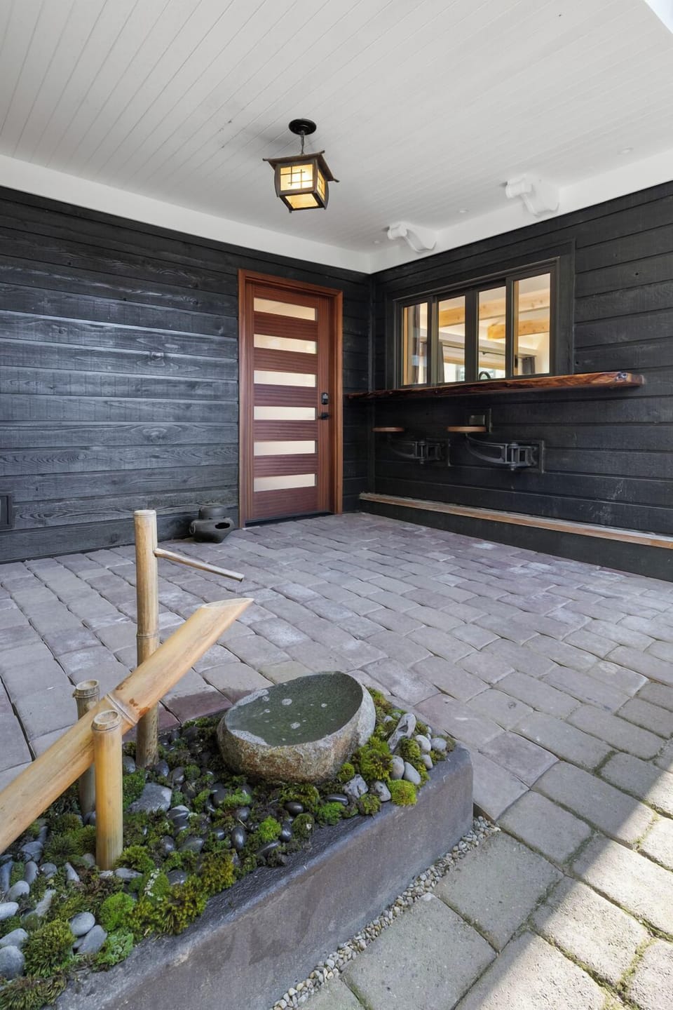 Front entrance: Bar seats with window that opens to the kitchen