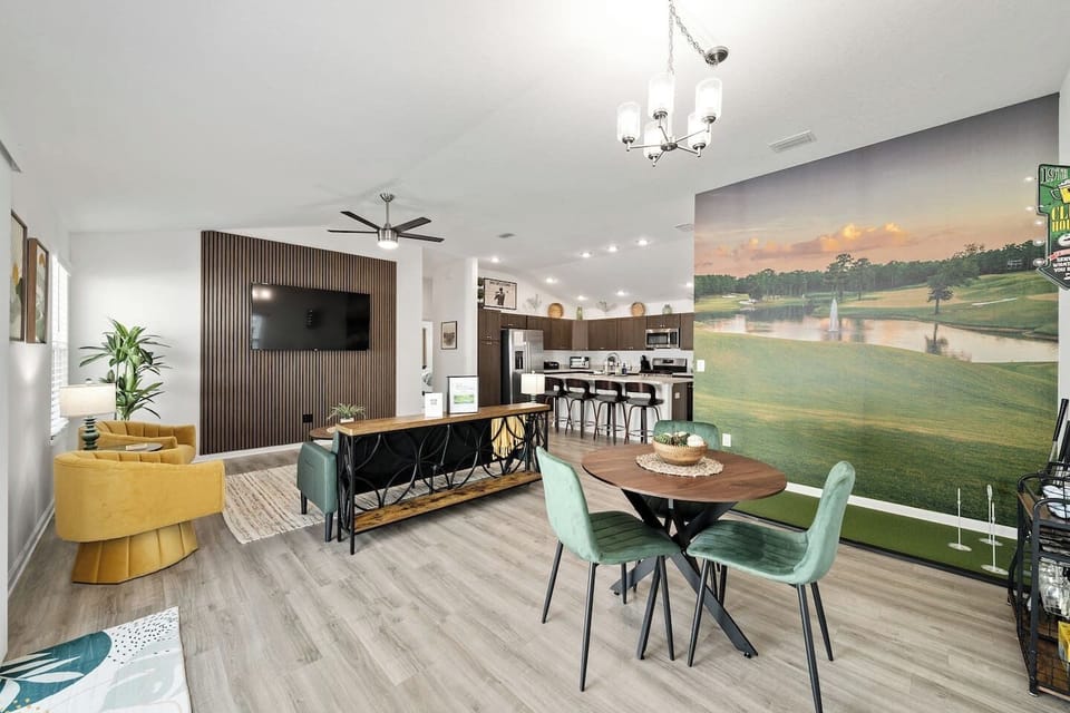 Nice open layout with a 65" tv and a putting green to practice before you play.