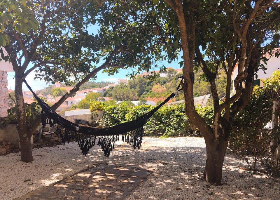 You have access to a lush garden with orange trees and a terrace.