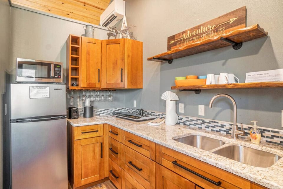 The kitchentte is fully functional, complete with 2 burner cooktop, sink and toaster oven
