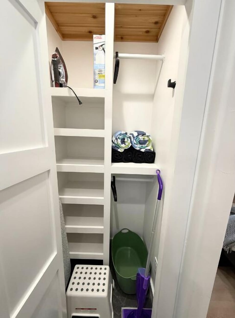 A large built-in closet with shelving and hanging space.