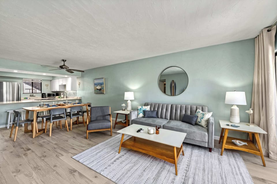 Open-Concept Living & Dining – Formal dining table with seating for six, additional breakfast bar stools for even more flexible seating