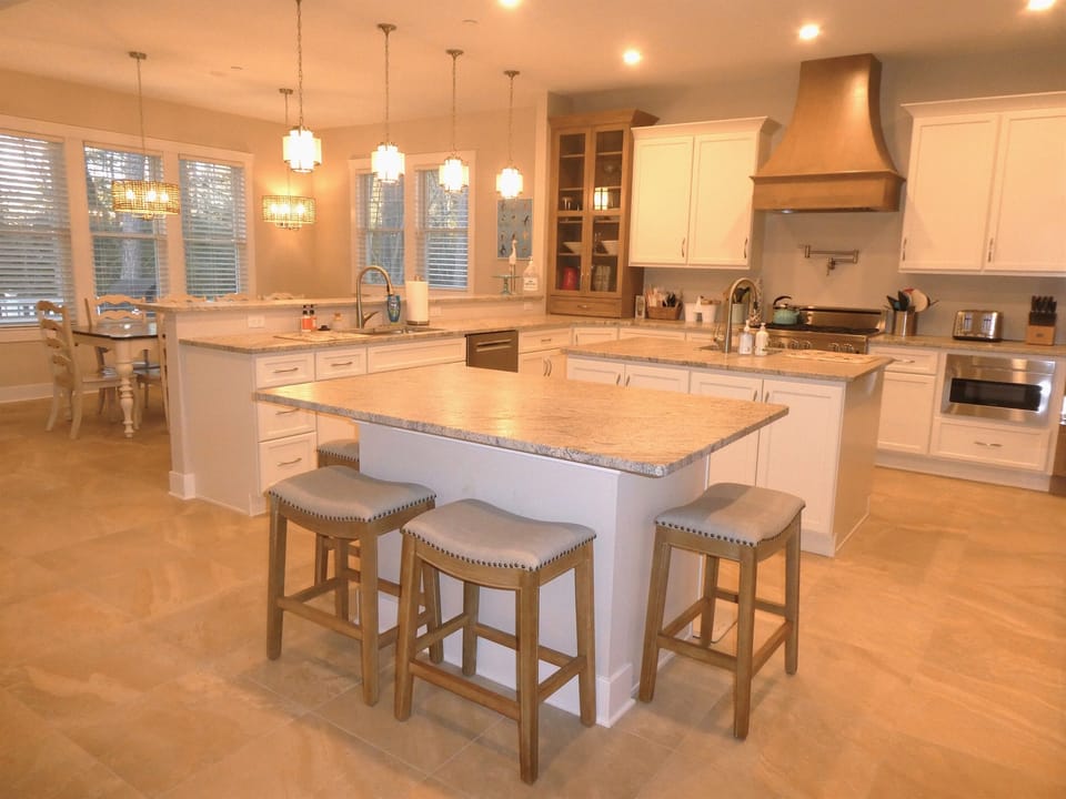 Kitchen opens up to great room and dining area for 10