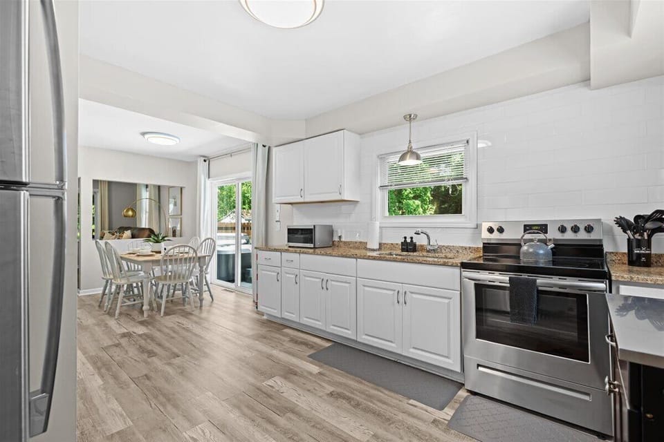 Bright kitchen with stainless steel appliances and open layout