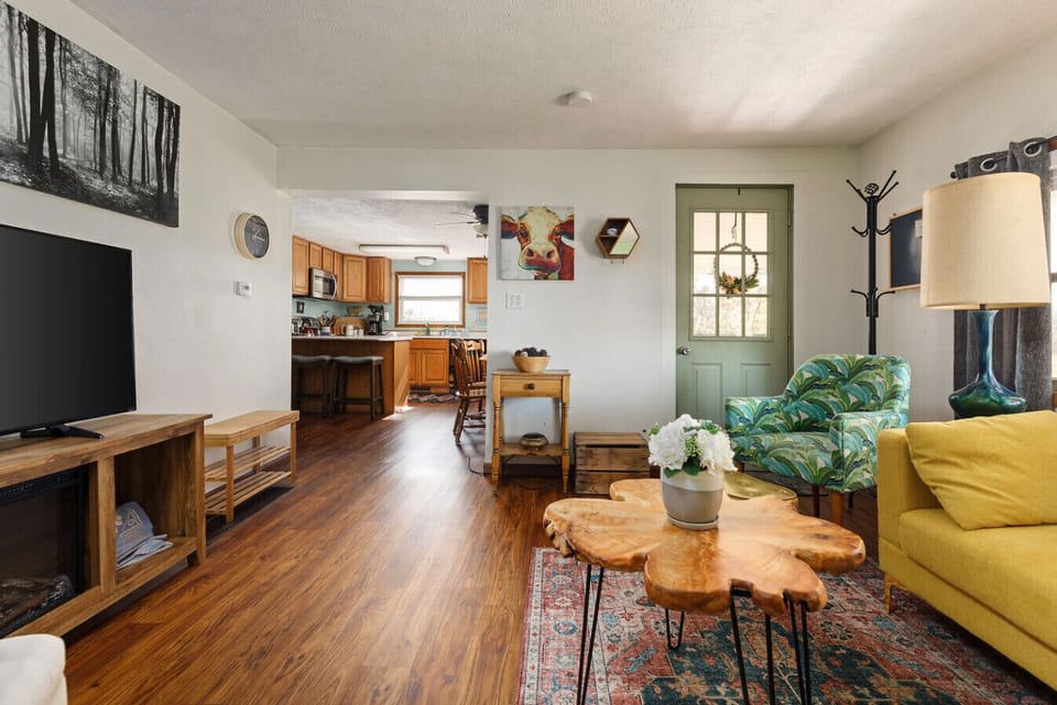 Relax in the cozy living room with direct access to the patio—perfect for enjoying a peaceful morning.