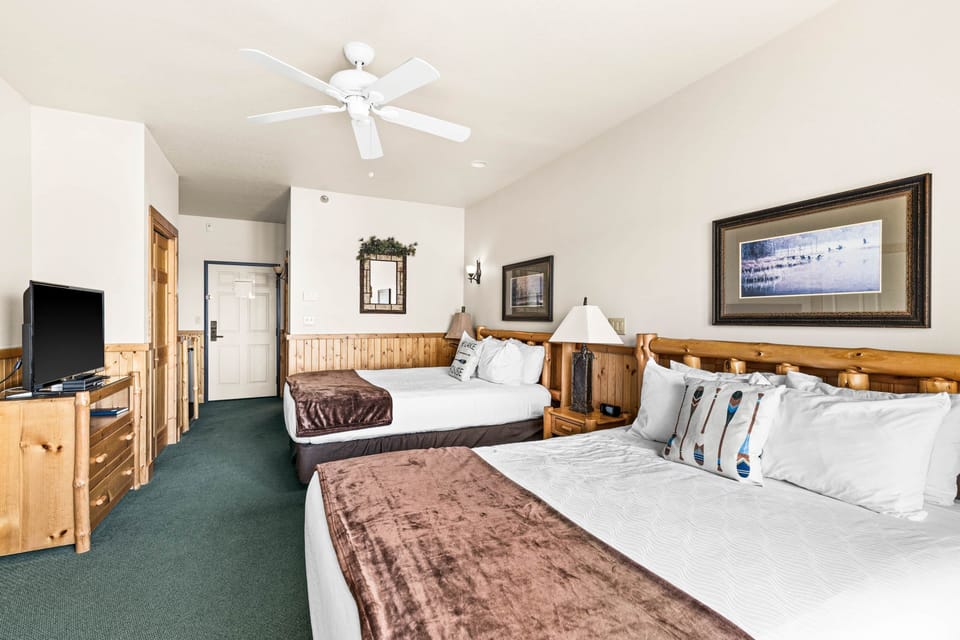 Two plush queen beds, a cozy fireplace, and sweeping lake views—your studio sanctuary awaits