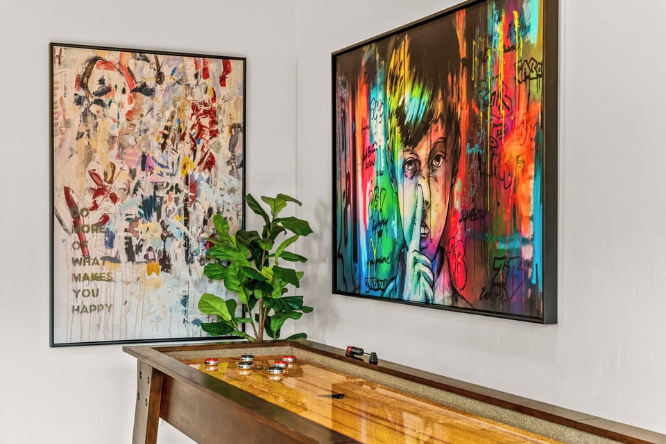 The space blends luxury finishes with a warm, livable feel.