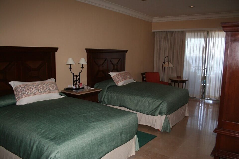 2nd bedroom with 2 queen beds and access to balcony/patio