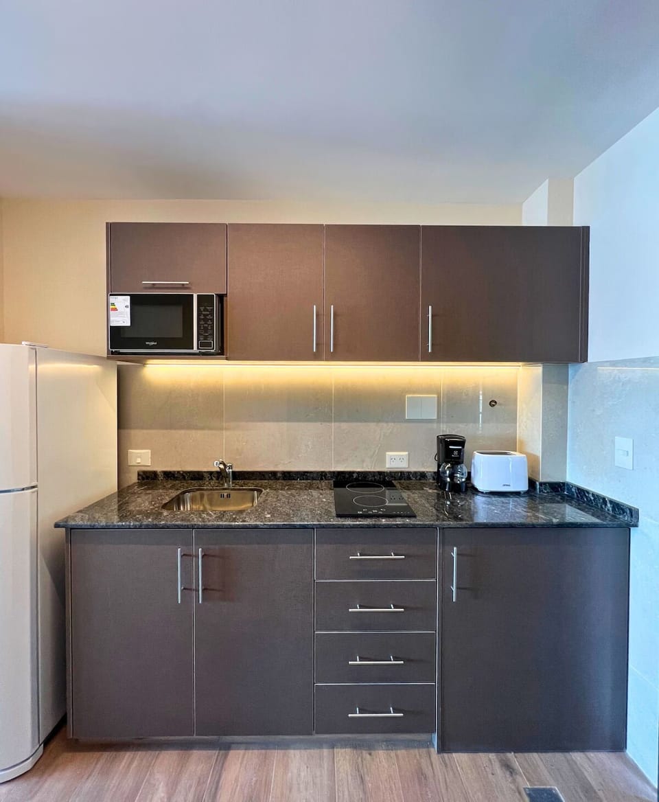 Prepare quick breakfasts with sleek counters and modern appliances.