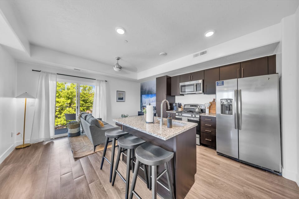Convenient Kitchen Near Living Area – Equipped with Utensils & Appliances