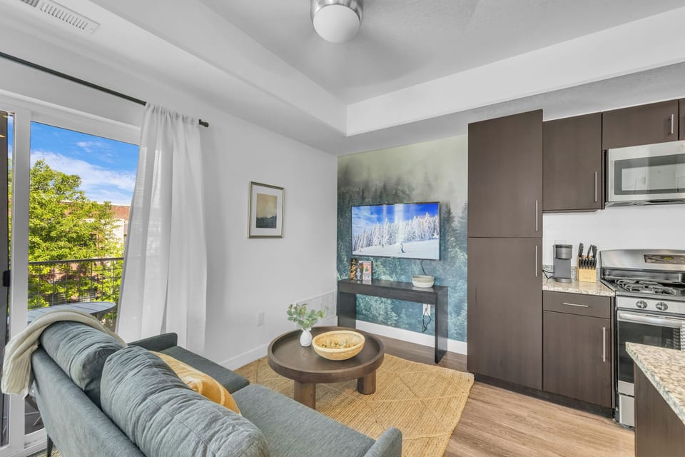 Unwind in the living room, complete with a comfortable sofa and TV. 