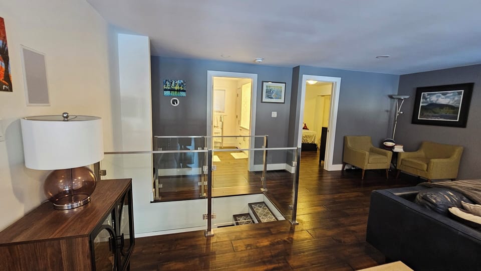 Upstairs living room, looking into bathroom (centre) and 2nd bedroom (right)
