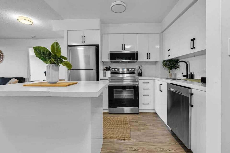 Modern kitchen with all essentials. Cook and dine with ease in your stylish condo!
