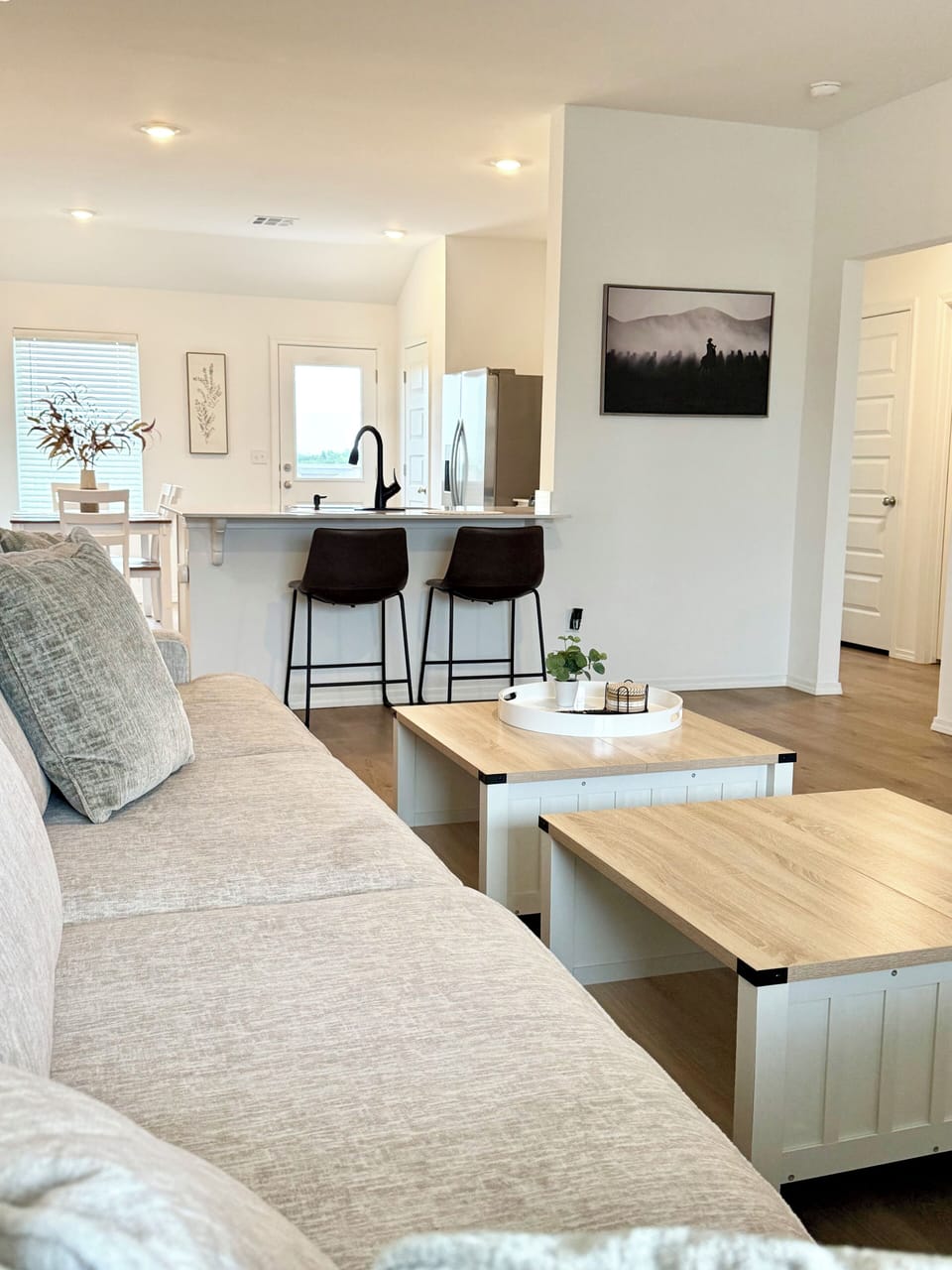 Spacious living room with 70 inch smart TV, extra large comfy couch. 
