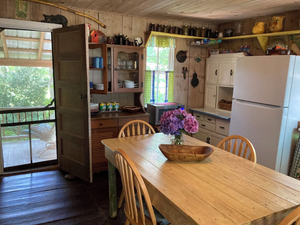 Kitchen. Door leading to the front porch. Opposite of the back deck.