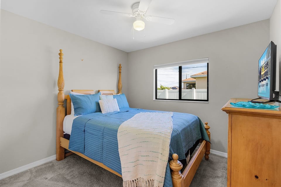 Guest room 3 is equipped with a Queen bed and smart TV