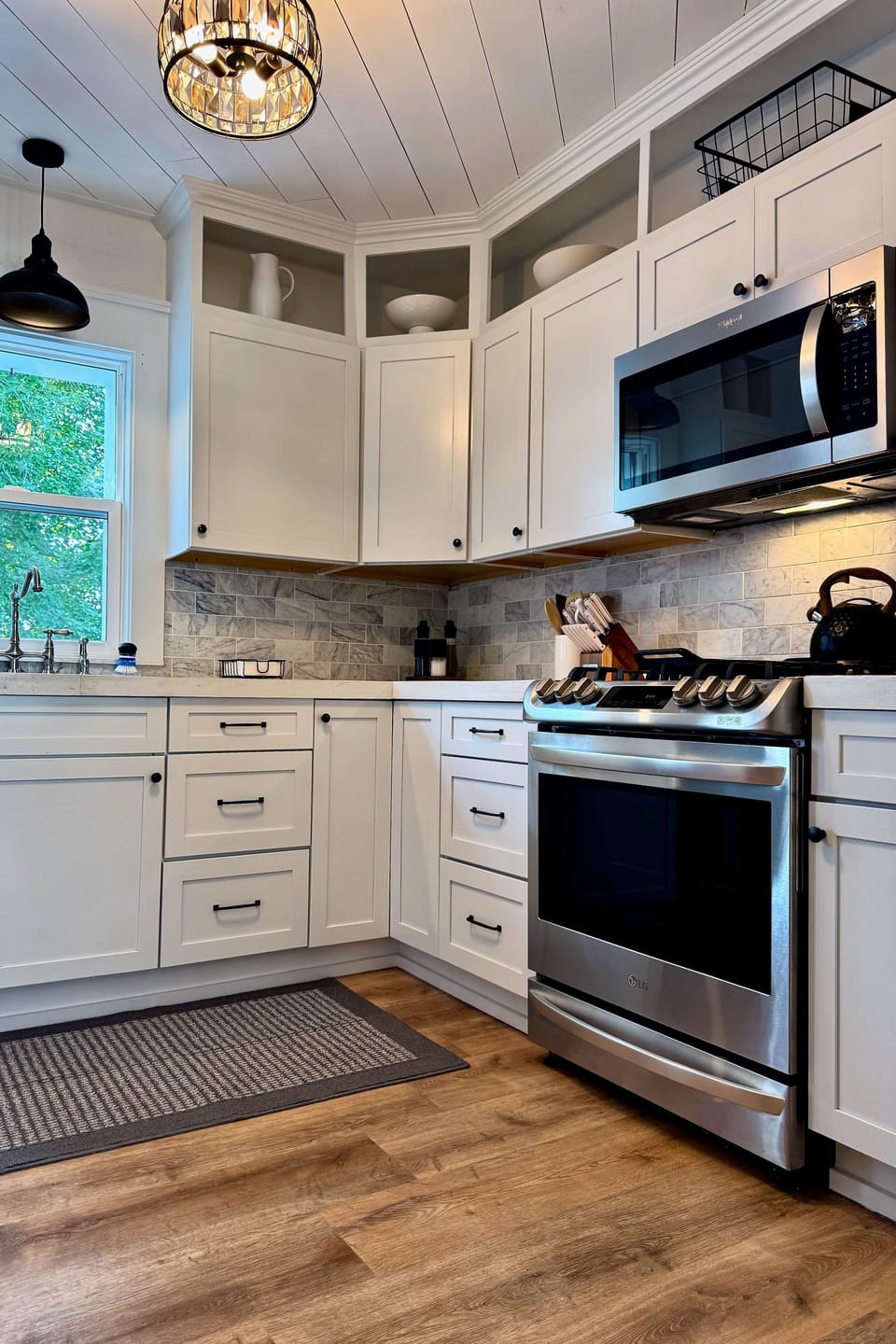 Kitchen - all updated with new cabinets, solid surface counters and equipment