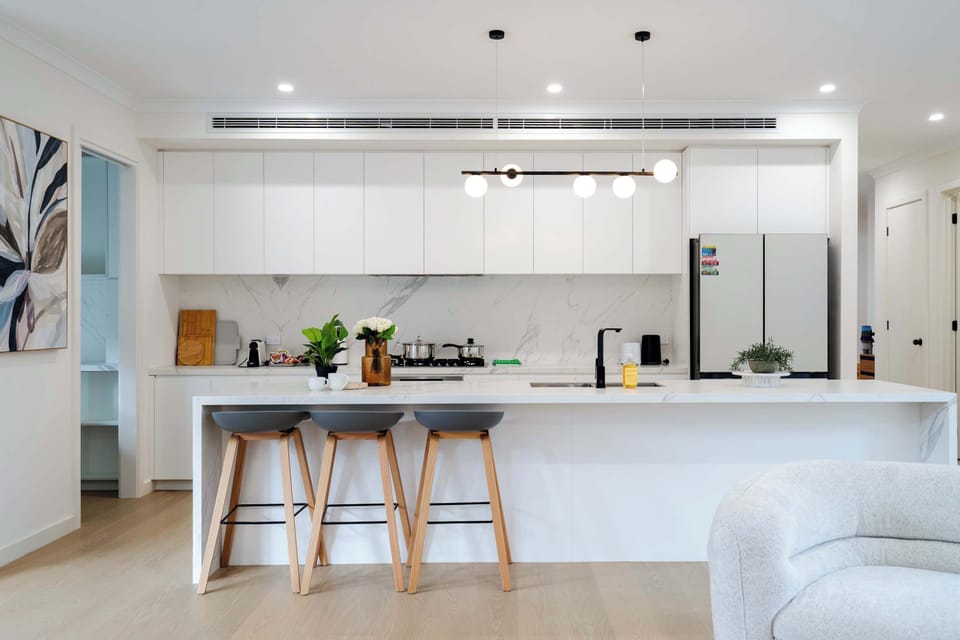 Full kitchen with bar stool for extra seatings and extra pantry storage at the left hand side 