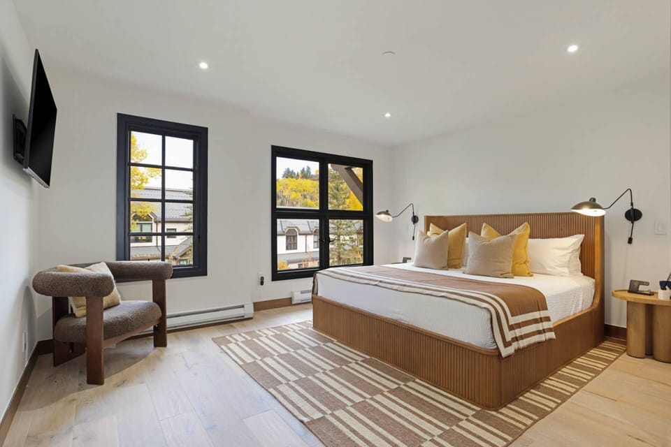 Primary Suite is spacious and appointed with high end modern furnishings.