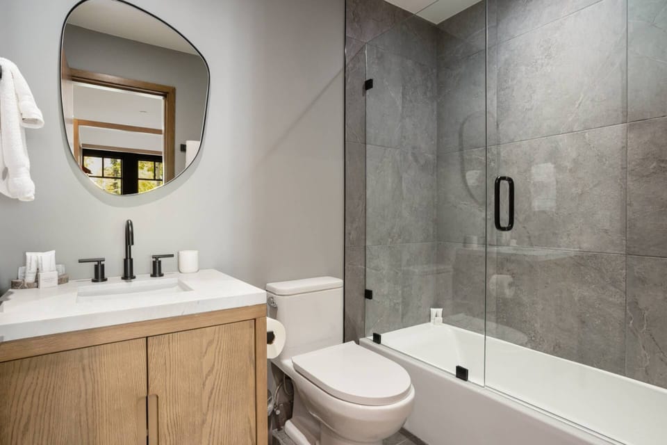 Guest Bedroom 3 en suite features a single vanity and tub/shower combo.