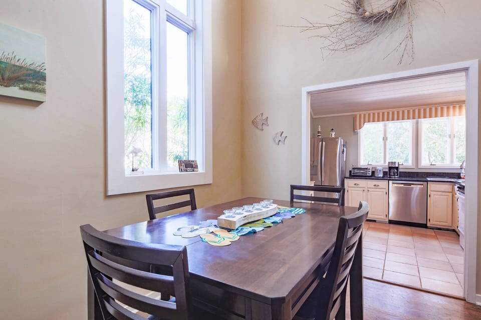 The dining table comfortably seats 4.