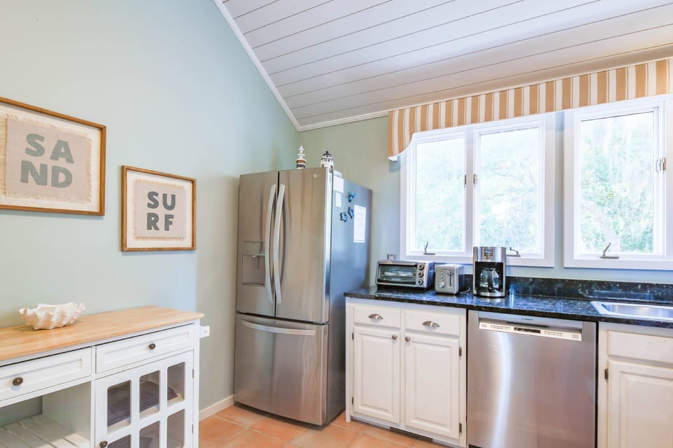 There is also a stainless steel refrigerator.