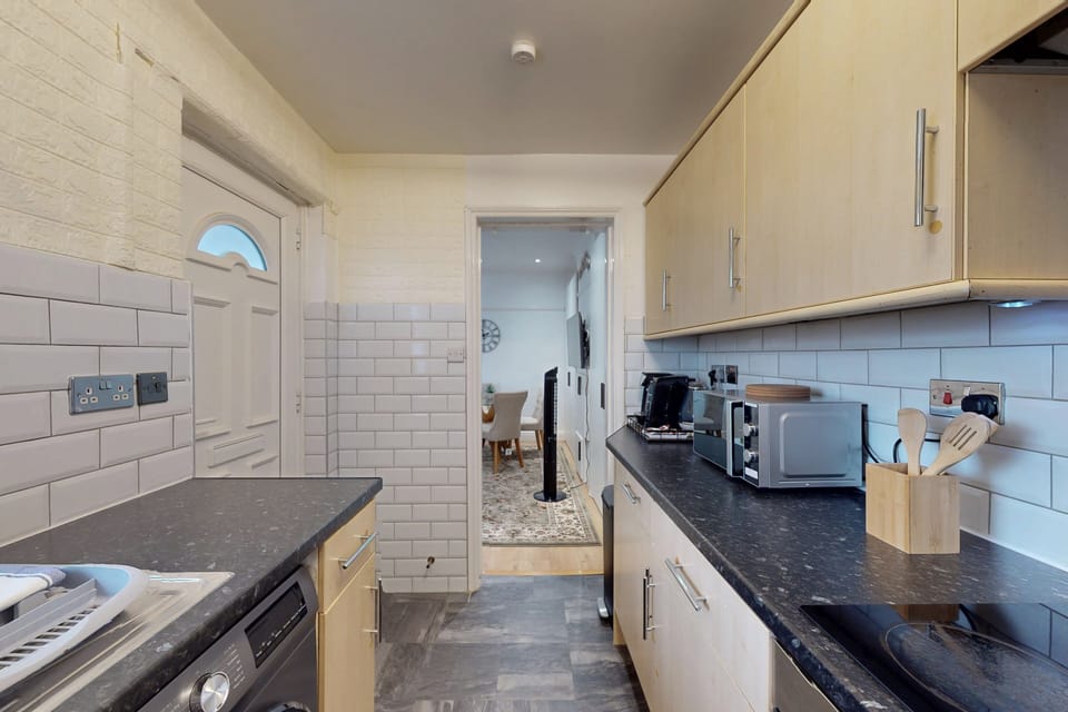 Kitchen area, featuring adequate counter space. 