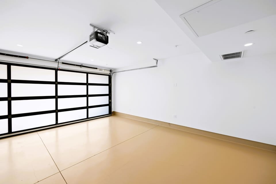 Private gated car garage. fits one regular size or 2 compact cars with the direct access to the house. 