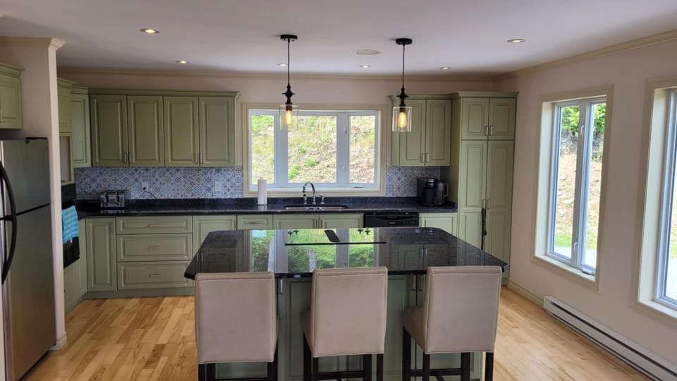 Large fully equipped kitchen with large island and Jennair range.
