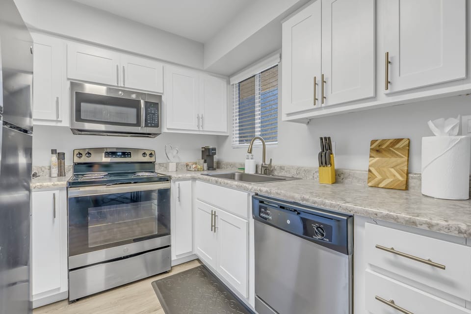 Modern fridge and ample counter space for easy meal prep.