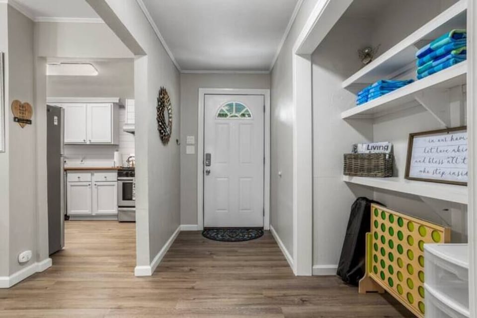Another angle of the hallway that leads to the kitchen and living area, where family memories will be made during your stay.