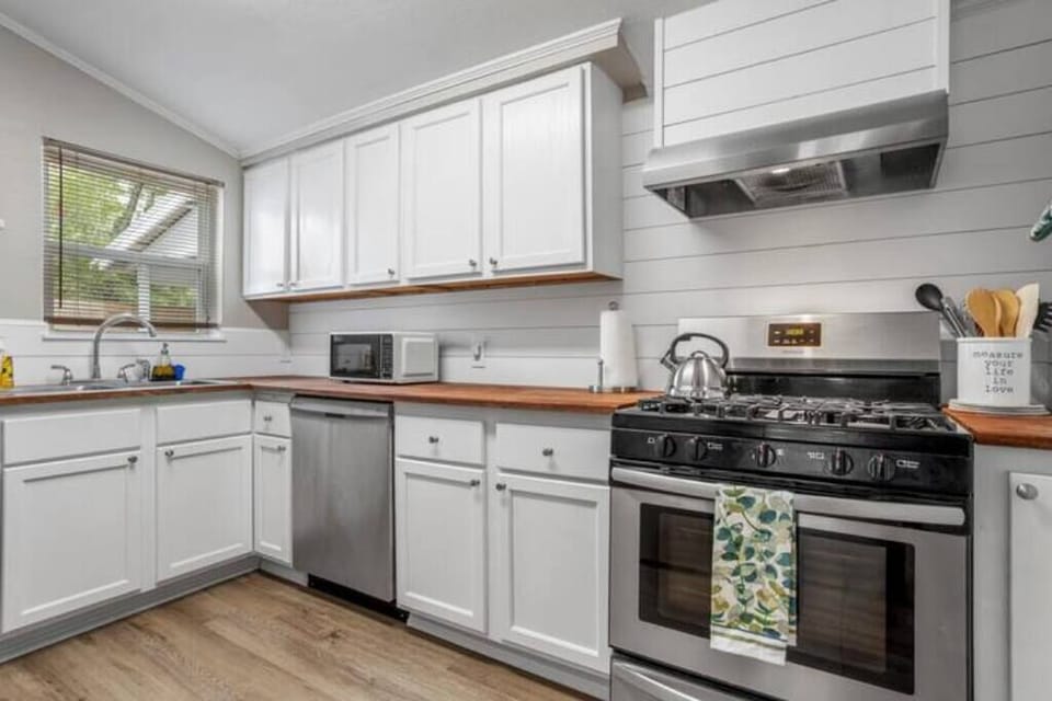 The modern kitchen is equipped with everything you need to whip up delicious meals, setting the stage for memorable dining experiences.