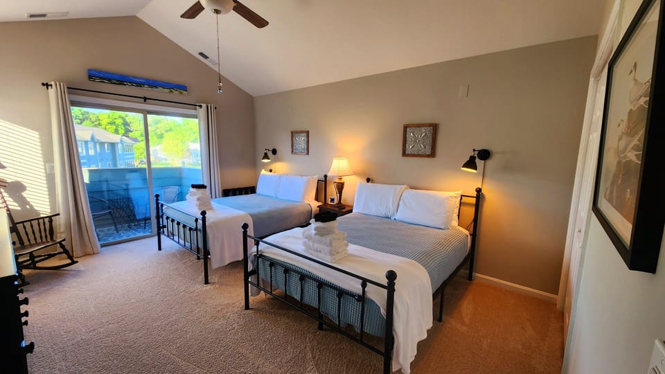 Bedroom #2 with two double beds and private balcony