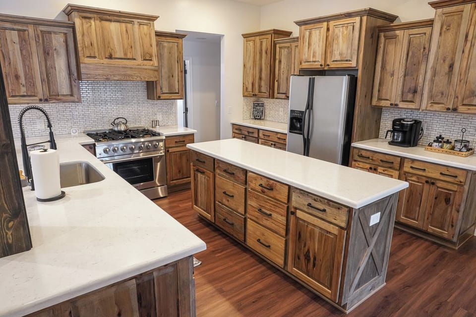 This kitchen has a 5-burner gas range, large oven and plenty of counter space!