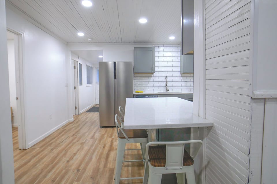 Kitchen with quartz countertops & peninsula