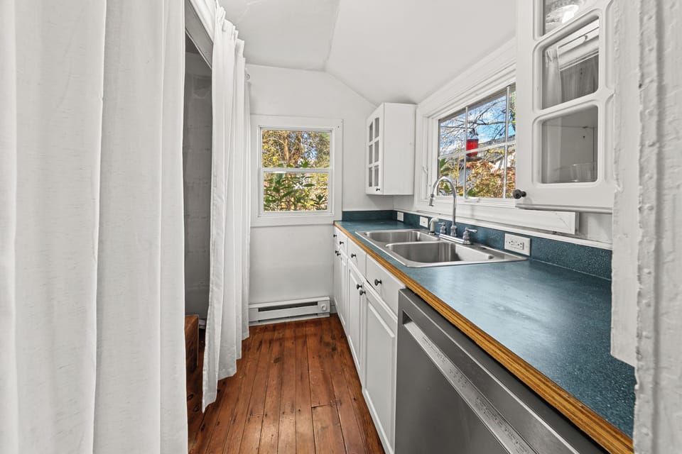 Dishwasher and double sink. Under-sink water filter on the cold water line. 