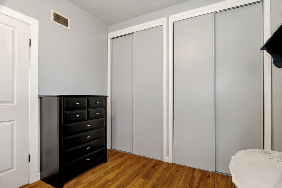 Full size bed, large dresser, large closets and fan