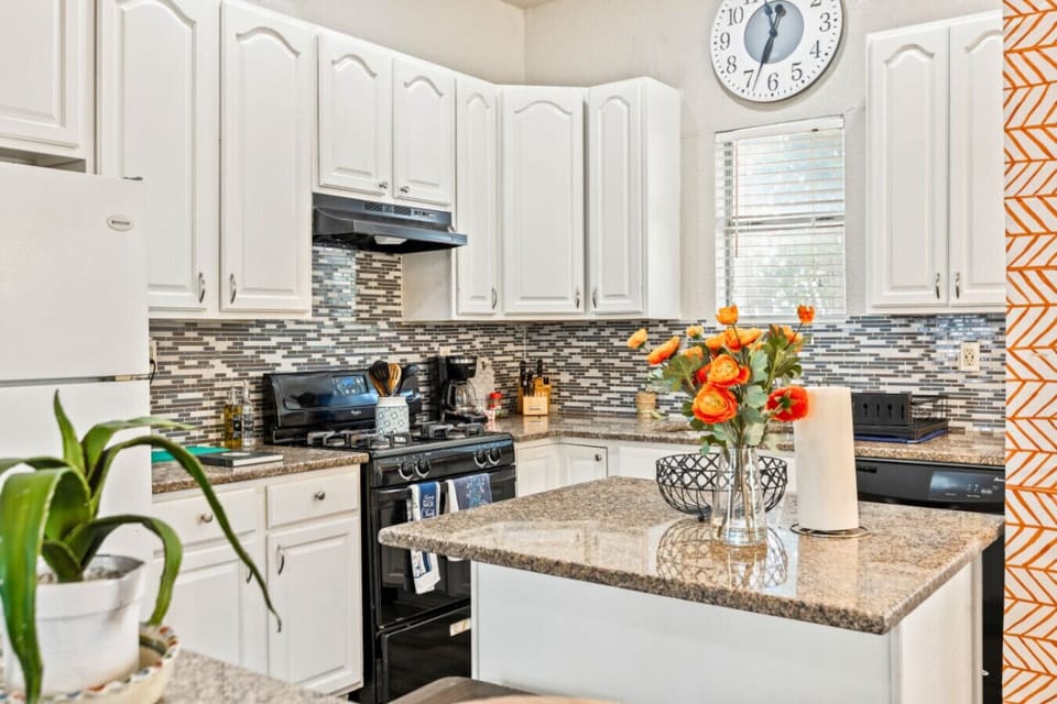 Modern Kitchen Glow – Natural light floods this sleek and fully stocked kitchen, perfect for whipping up breakfast or hosting dinner.