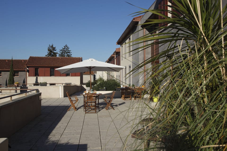 Unwind on the spacious terrace with shaded alfresco seating.