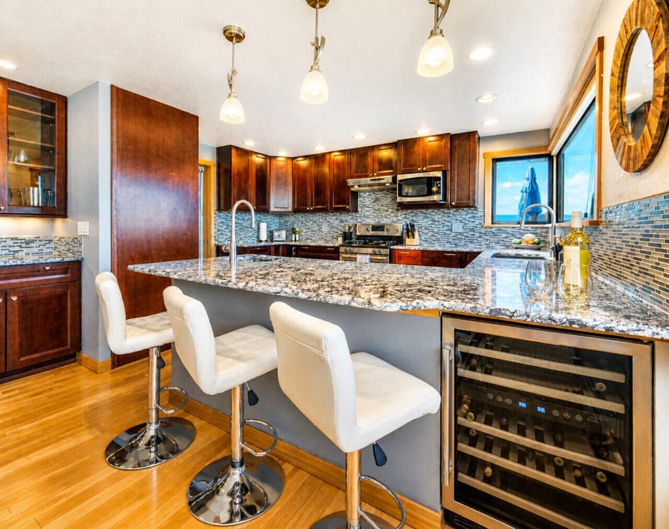 Modern Coastal Kitchen & Bar Seating with Granite Countertops
