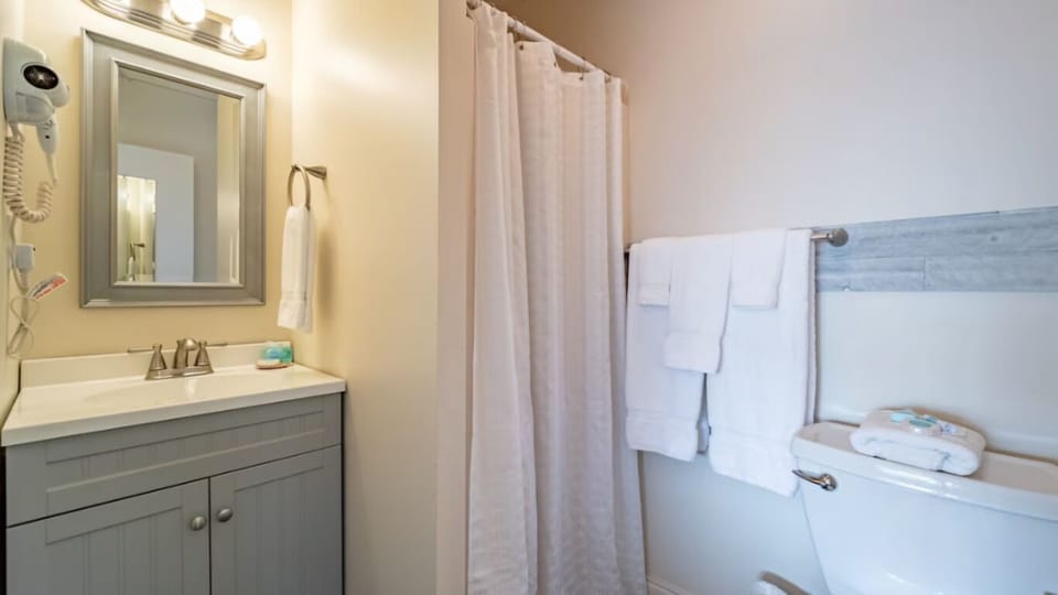 Refresh with fluffy towels and a spotless vanity setup.